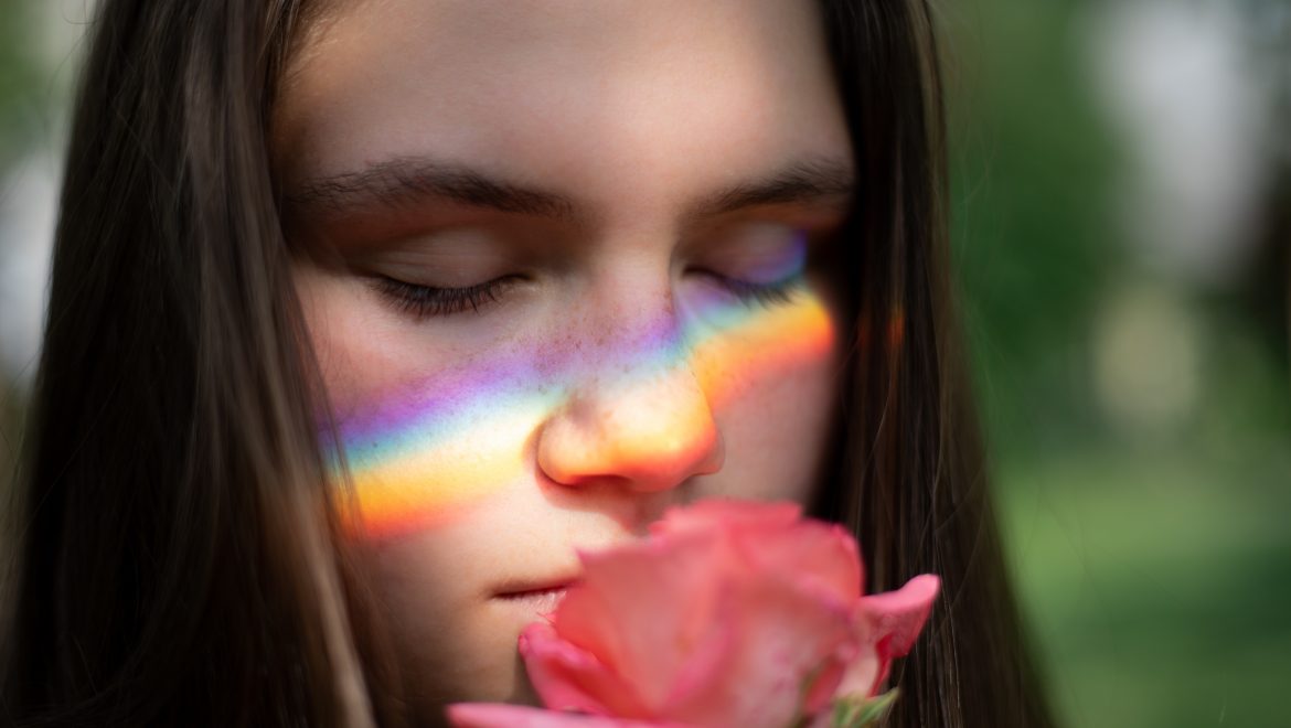 close up photography of woman smelling pink rose 1170654