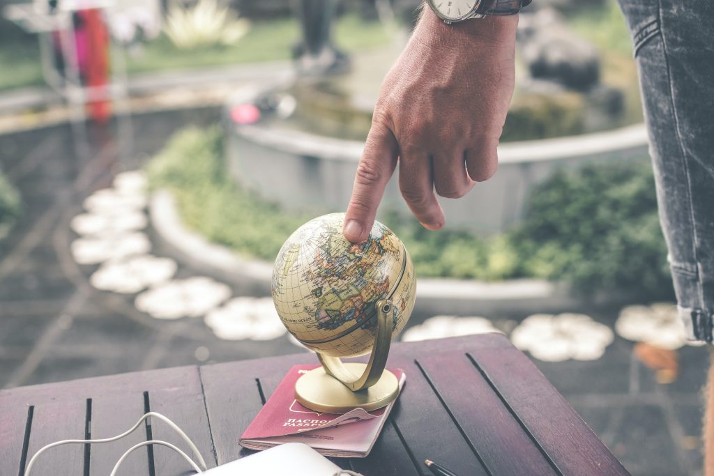 person holding terrestrial globe scale model taken 1079033
