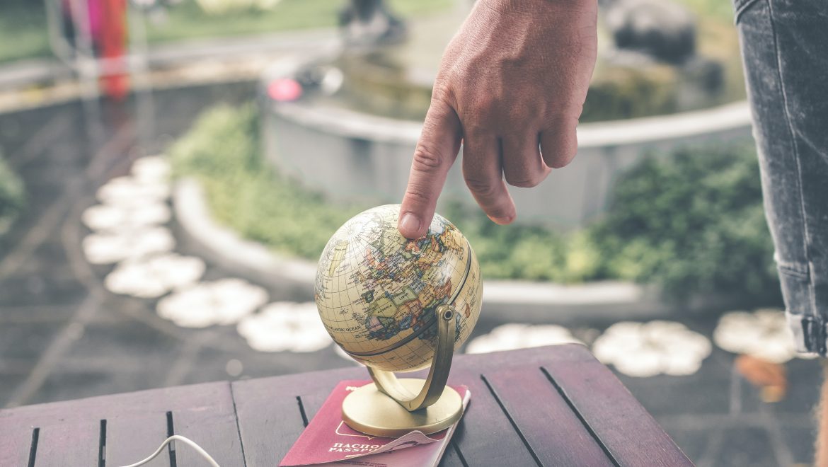 person holding terrestrial globe scale model taken 1079033