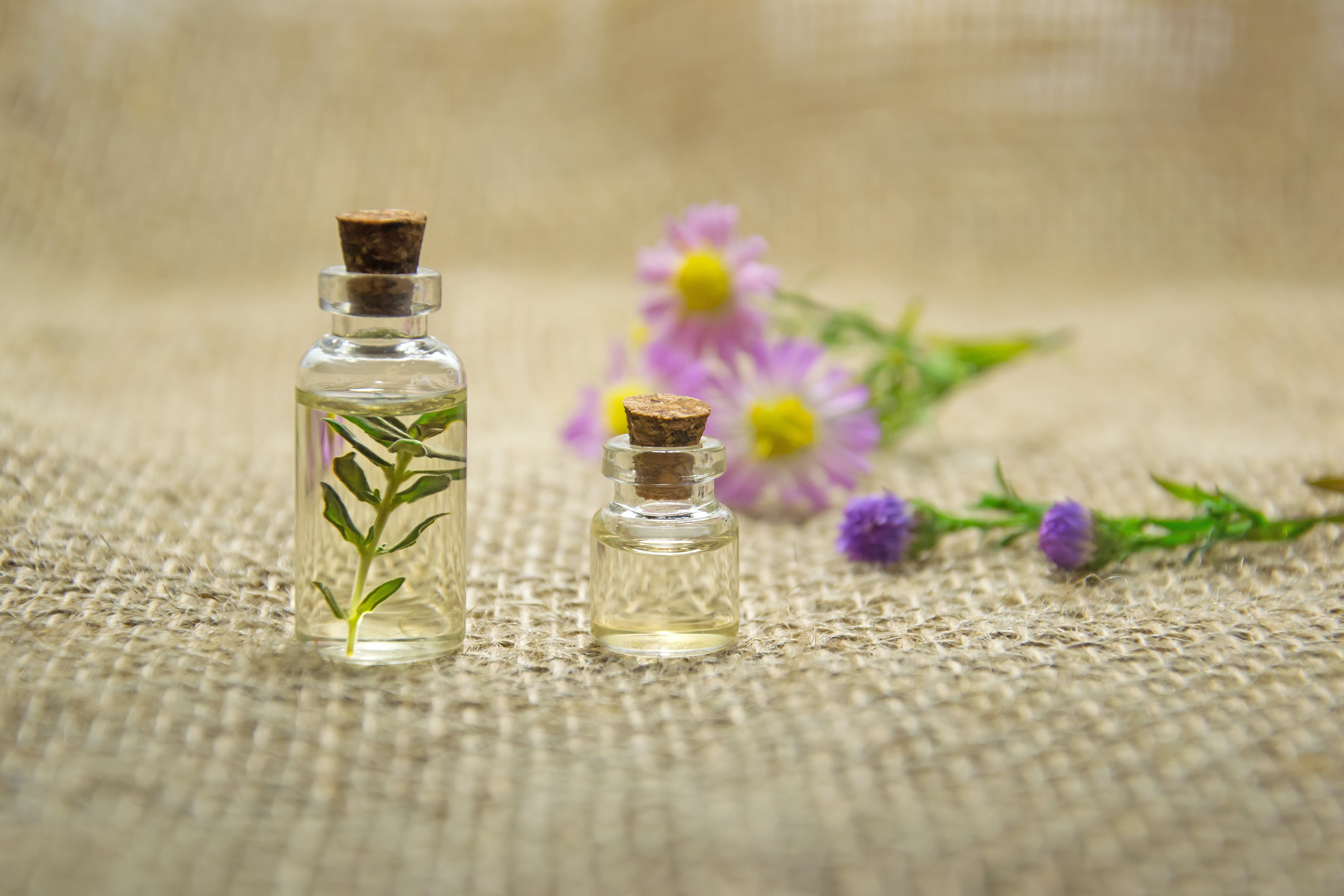 two clear glass bottles with liquids 672051