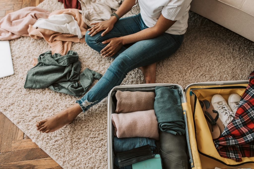 long distance expat relationships woman packing suitcase expat nest