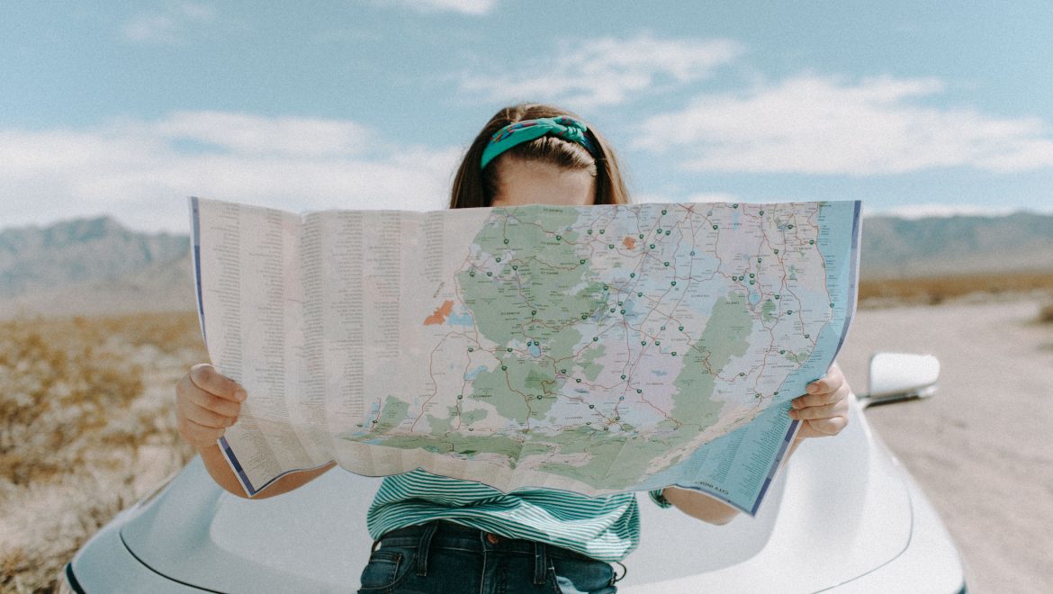 values expat nest woman on road trip with map