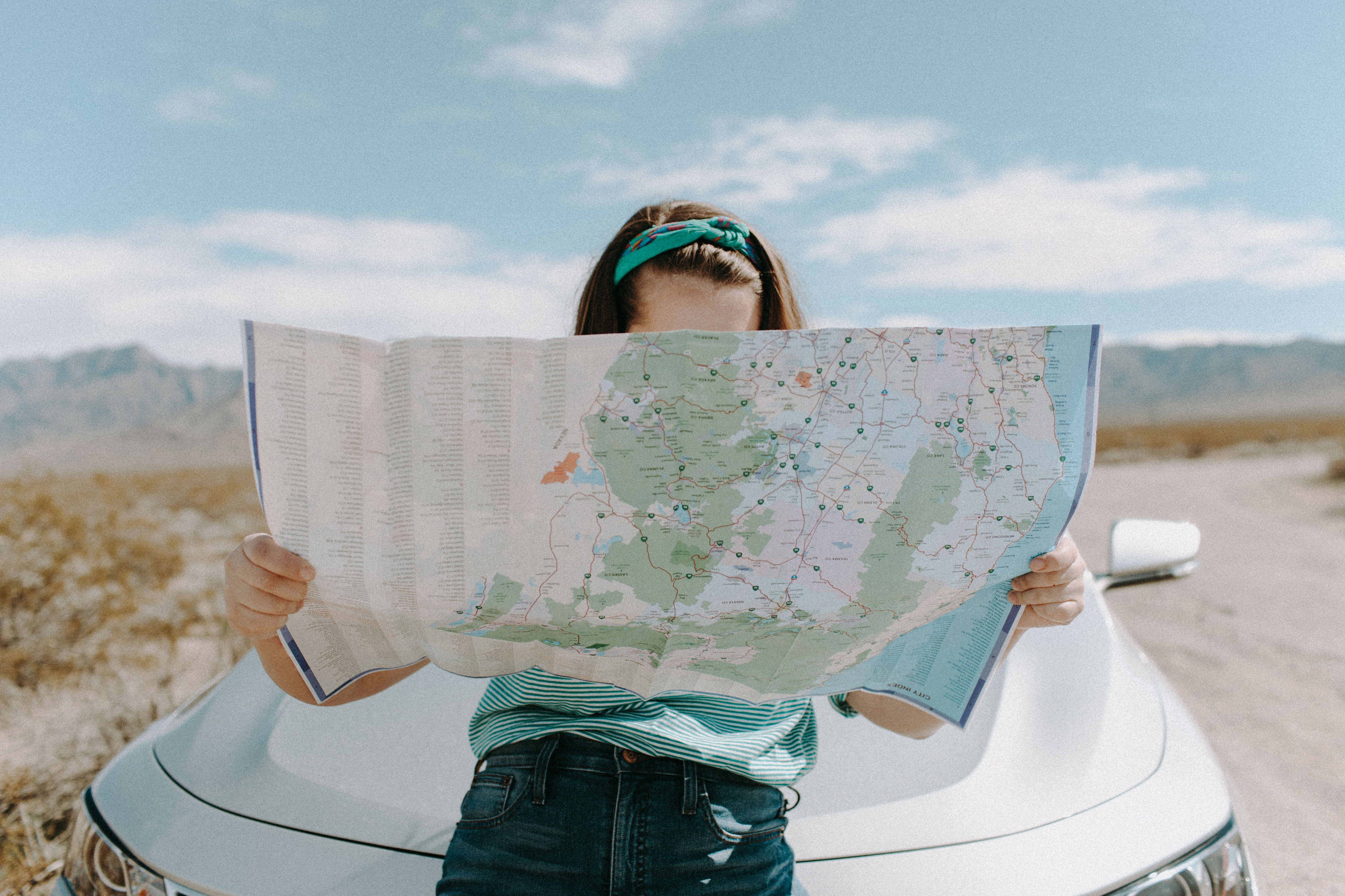 values expat nest woman on road trip with map